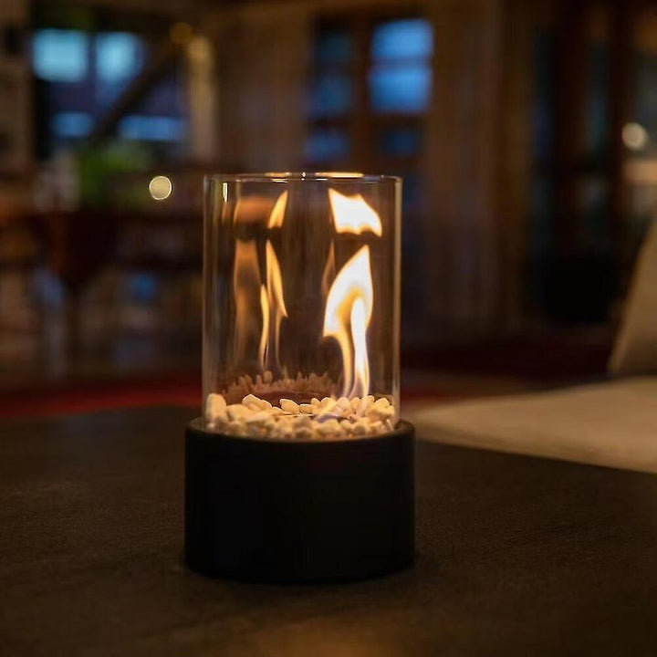 Chic black tabletop oil lamp with glass shade, providing sophisticated indoor ambient lighting.
