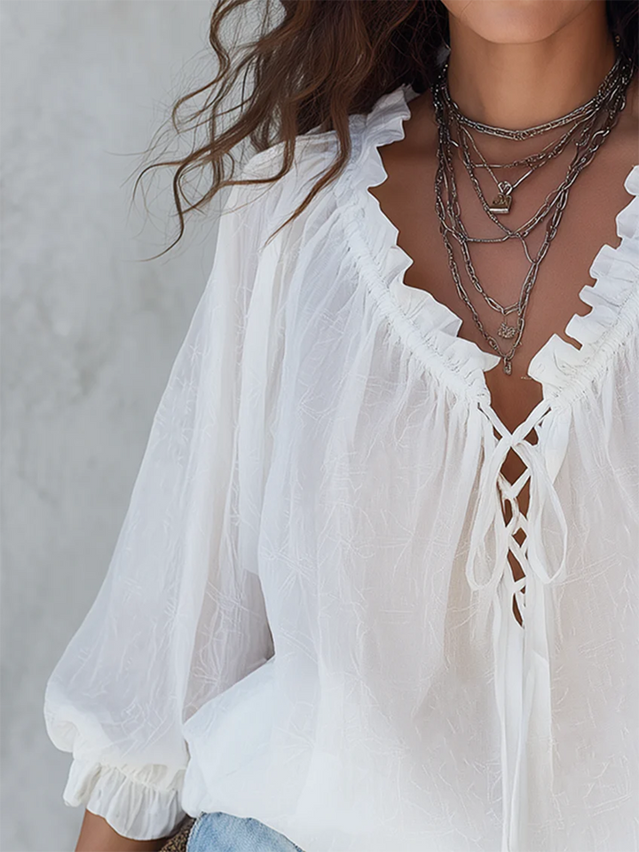 Chic white V-neck ruffle long-sleeve blouse for women. Relaxed fit, elegant for spring/summer casual & office.