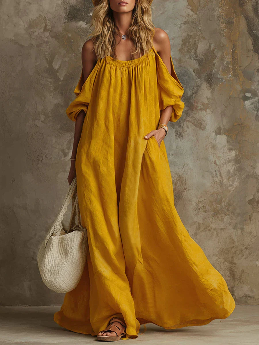 Women's off-shoulder boho maxi dress with elegant flare sleeves, perfect for summer casual or beachwear.