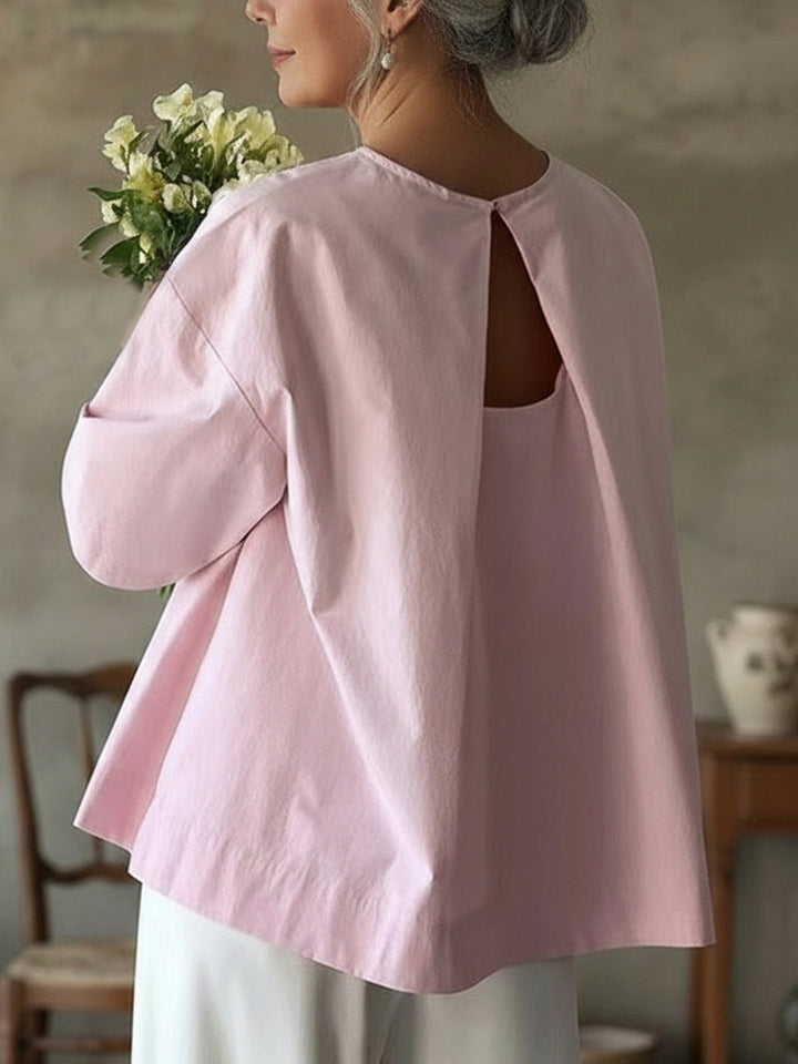 Women's loose fit long sleeve blouse in white. Effortless everyday style, comfortable casual top.