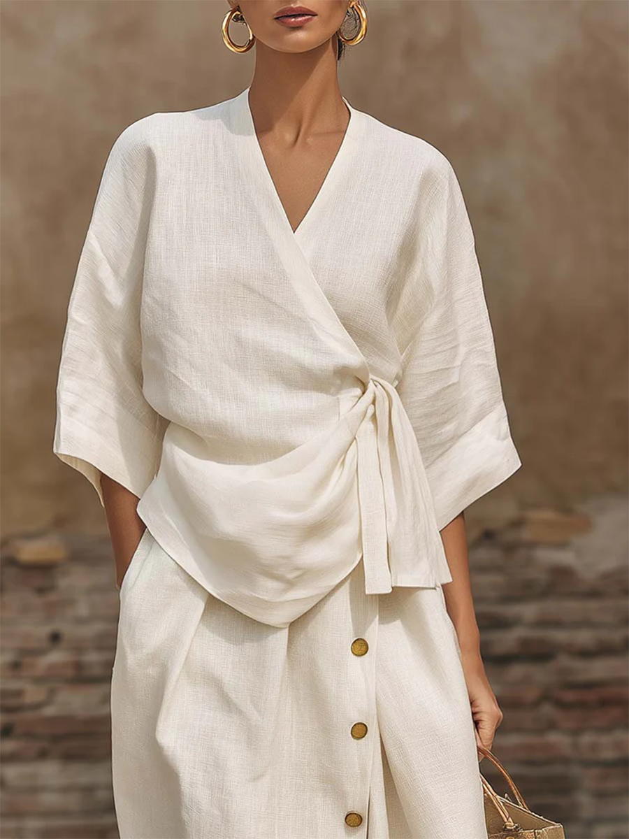Women's versatile outfit set featuring a comfortable wrap top & chic button-front midi skirt. Day-to-night style.