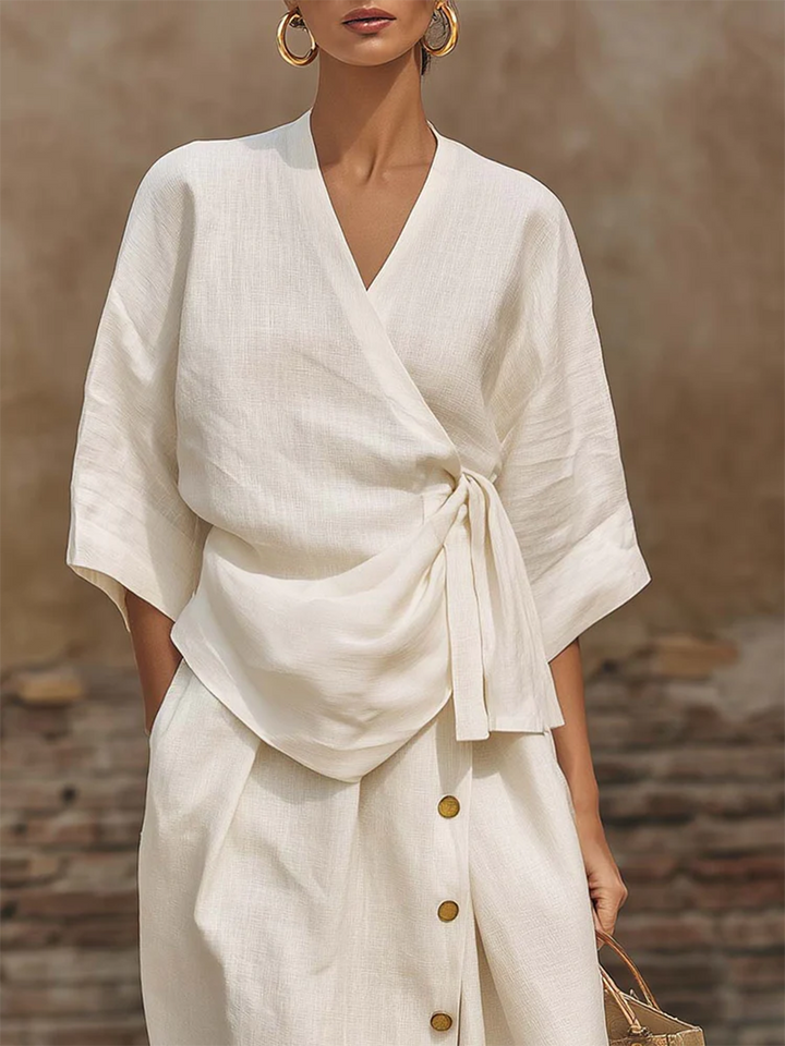 Women's versatile outfit set featuring a comfortable wrap top & chic button-front midi skirt. Day-to-night style.