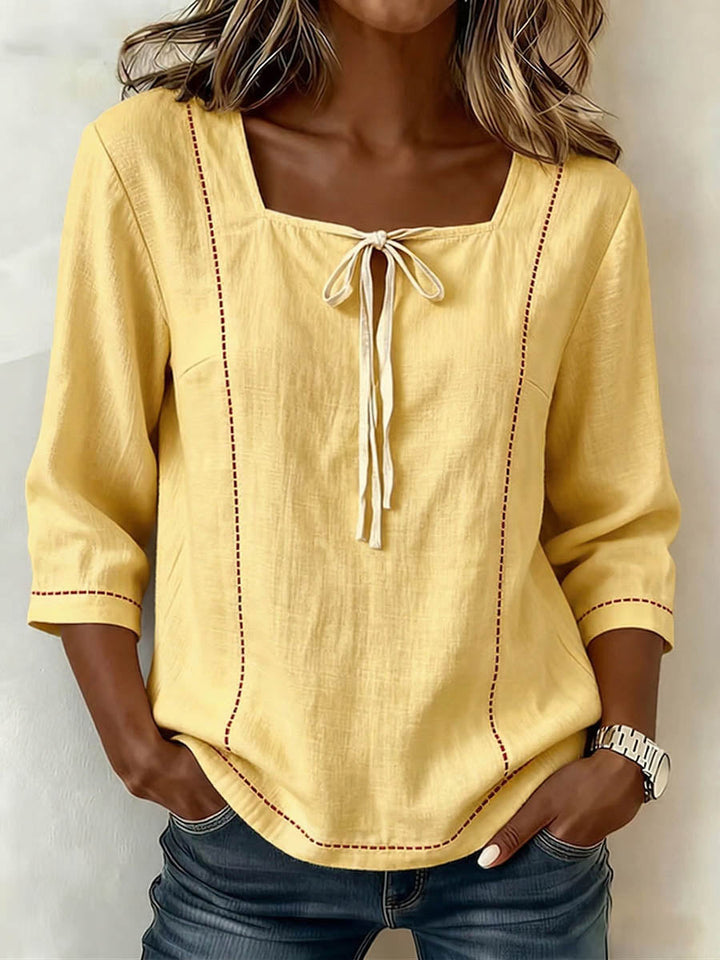 Chic women's square neck blouse with elegant 3/4 sleeves, offering a professional yet fashionable look.