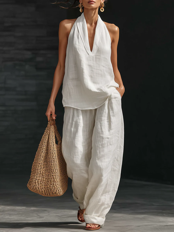 Women's halter neck top & wide leg pants outfit set in a chic, comfy summer style for any occasion.