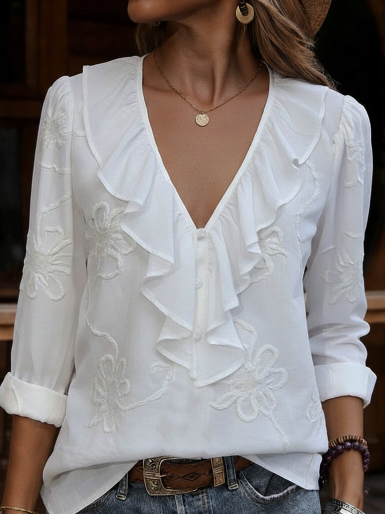 Women's elegant V-neck blouse with floral embroidery & ruffle trim. Long sleeve top for spring/summer fashion.