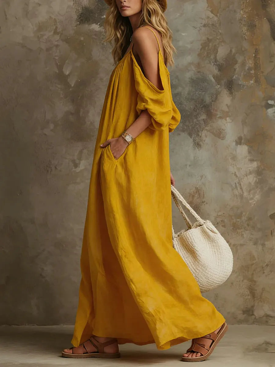 Bohemian off-shoulder maxi sundress for women, featuring flowy fabric & flare sleeves. Ideal for beach or summer.
