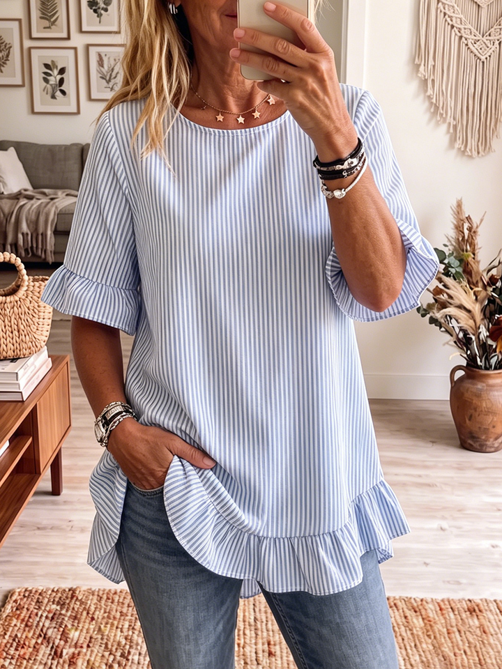 Women's striped short sleeve blouse with elegant ruffle hem, ideal for casual summer style.
