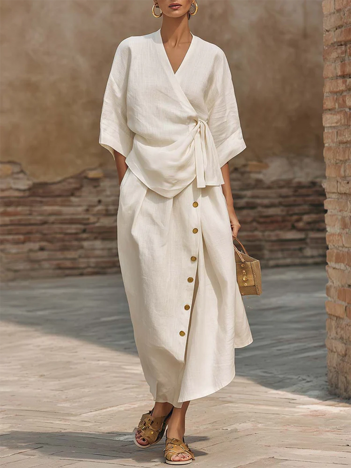 Elegant women's wrap top and midi button skirt two-piece set, perfect for stylish spring/summer fashion.
