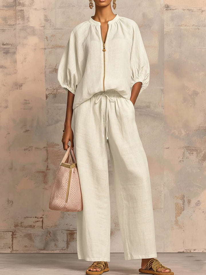 Stylish women's two-piece set featuring wide-leg pants and a matching relaxed-fit shirt for modern casual wear.
