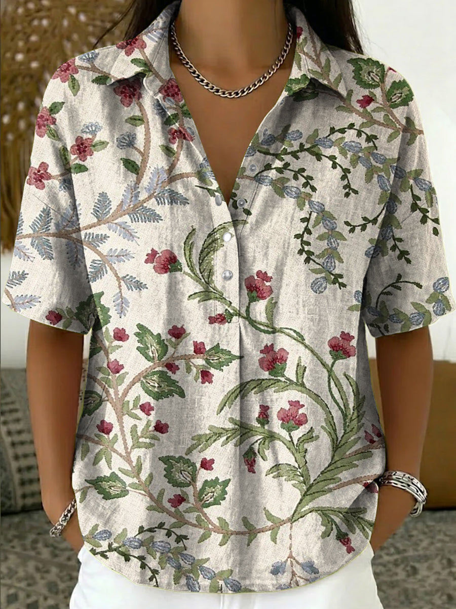 Women's multi-color floral print short sleeve V-neck blouse. Elegant, comfortable casual top for summer fashion.