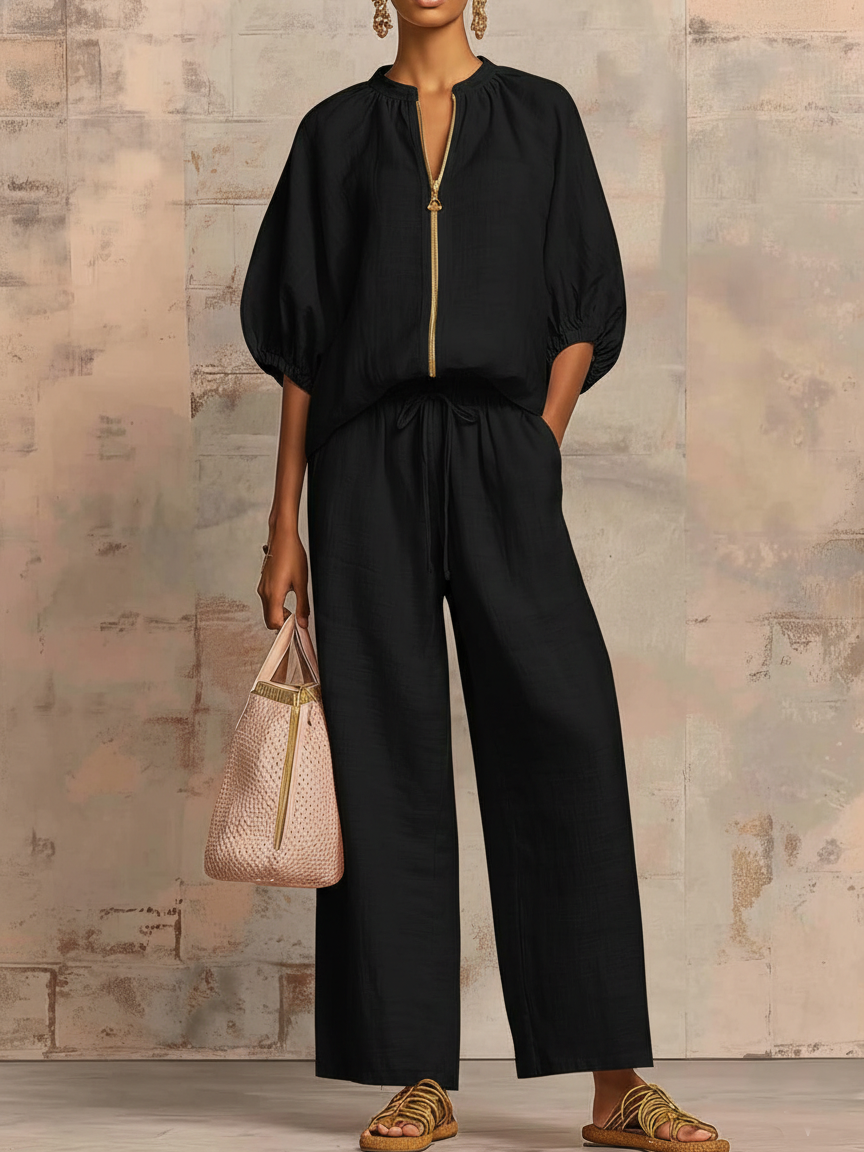 Women's matching two-piece set: comfortable wide-leg pants & a stylish shirt. Versatile for casual and lounge wear.