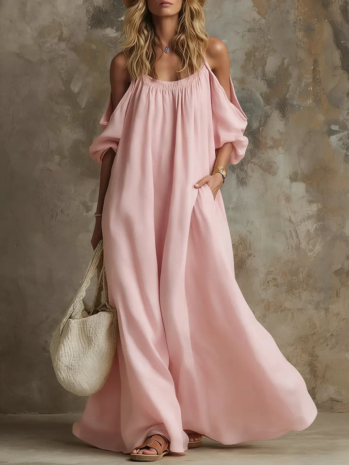 Stylish women's long off-shoulder boho maxi dress, featuring flowy flare sleeves & a relaxed summer beach vibe.