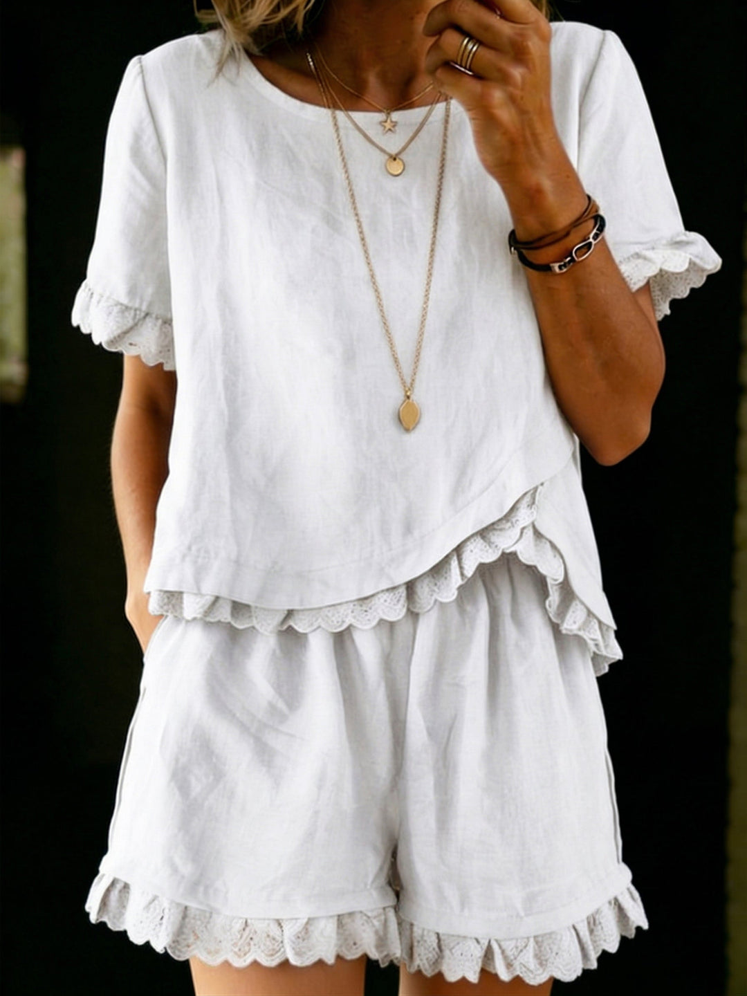 Stylish women's summer outfit: flowy ruffle top & matching shorts. Perfect for casual wear or beach trips.