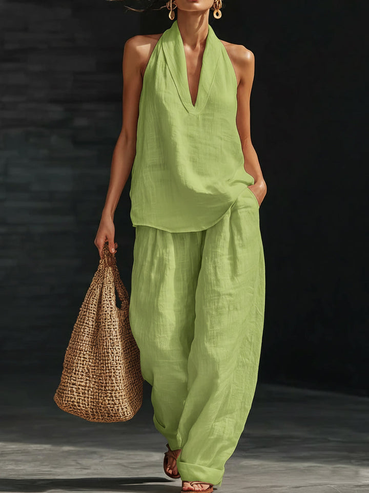 Women's summer outfit: a fashionable halter neck top paired with comfortable wide-leg pants.