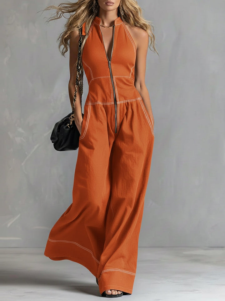 Woman in a stylish sleeveless V-neck wide leg jumpsuit, showcasing comfortable casual fashion and modern apparel.