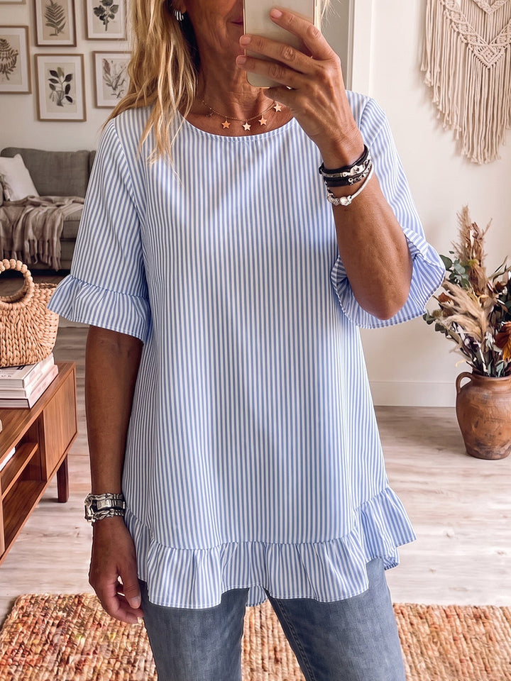 Chic women's striped blouse with ruffle details, a versatile short sleeve top for work or vacation.