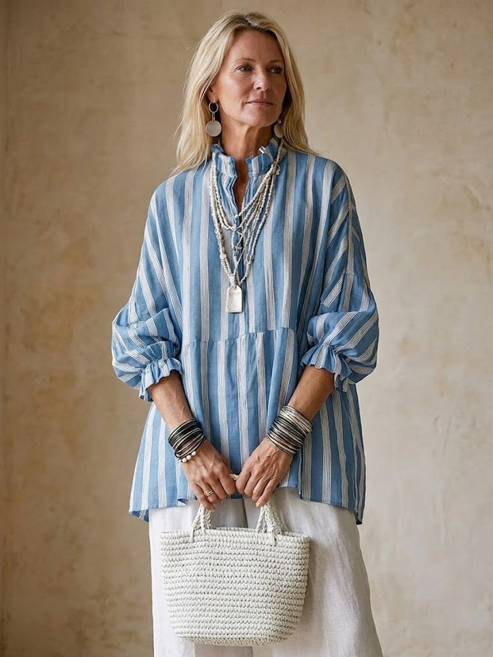 Boho-inspired women's striped V-neck ruffle blouse with trendy lantern sleeves, a versatile casual top.