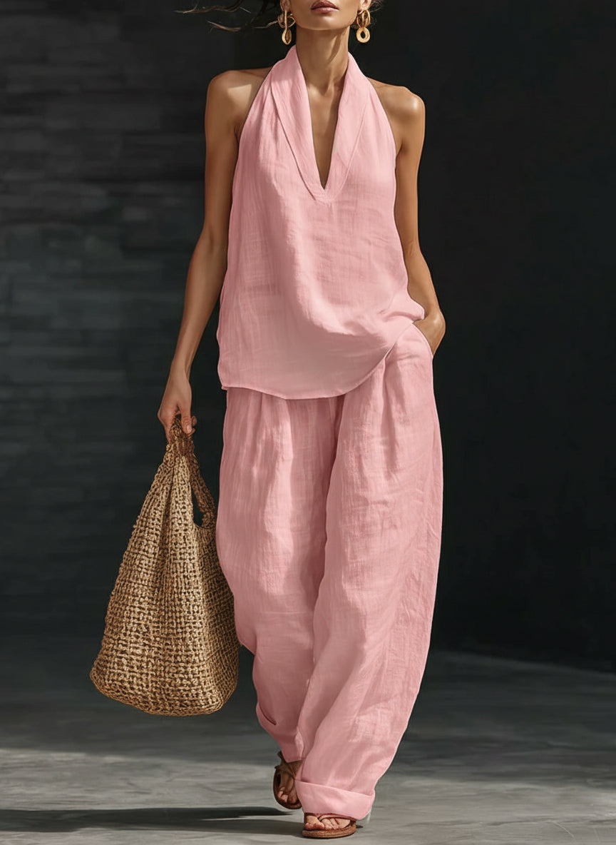 Trendy women's halter top and wide-leg pants matching set for a chic, casual summer or holiday look.