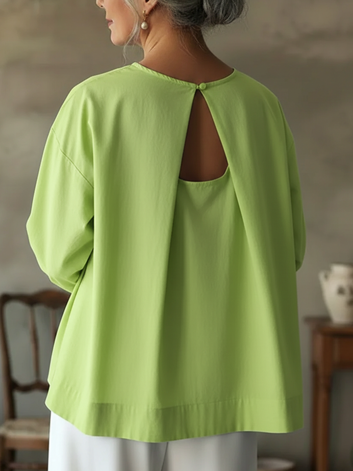 Stylish women's long sleeve crew neck blouse, offering a comfortable, loose fit for effortless everyday fashion.