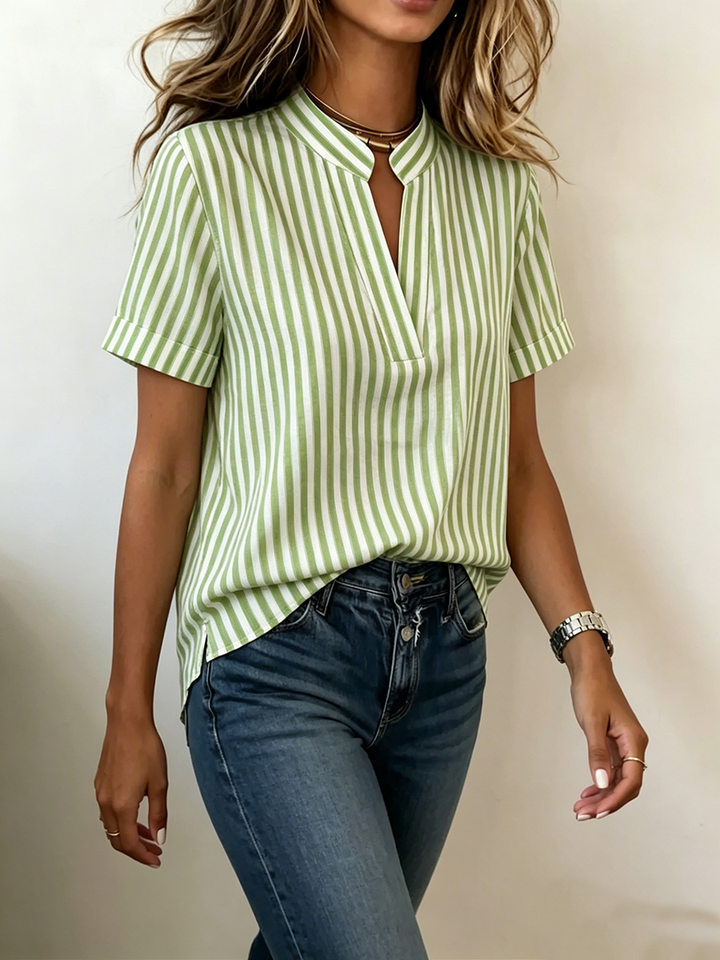 Relaxed fit women's striped V-neck short sleeve tunic blouse, perfect for work or everyday wear.