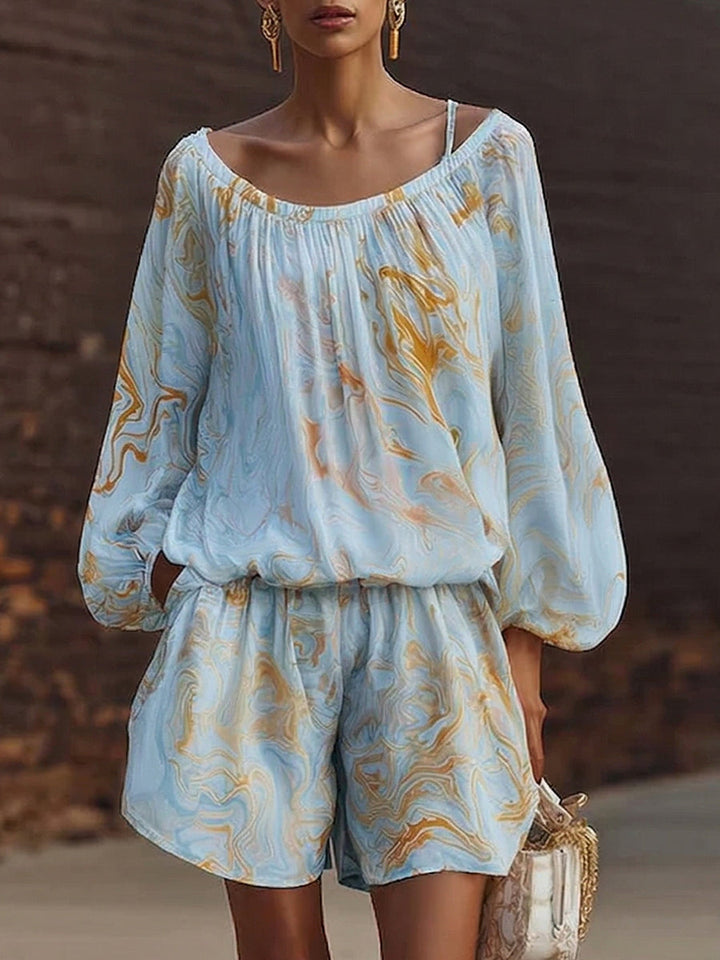 Women's relaxed fit shorts and long-sleeve top set. An effortless summer outfit for casual, comfortable loungewear.