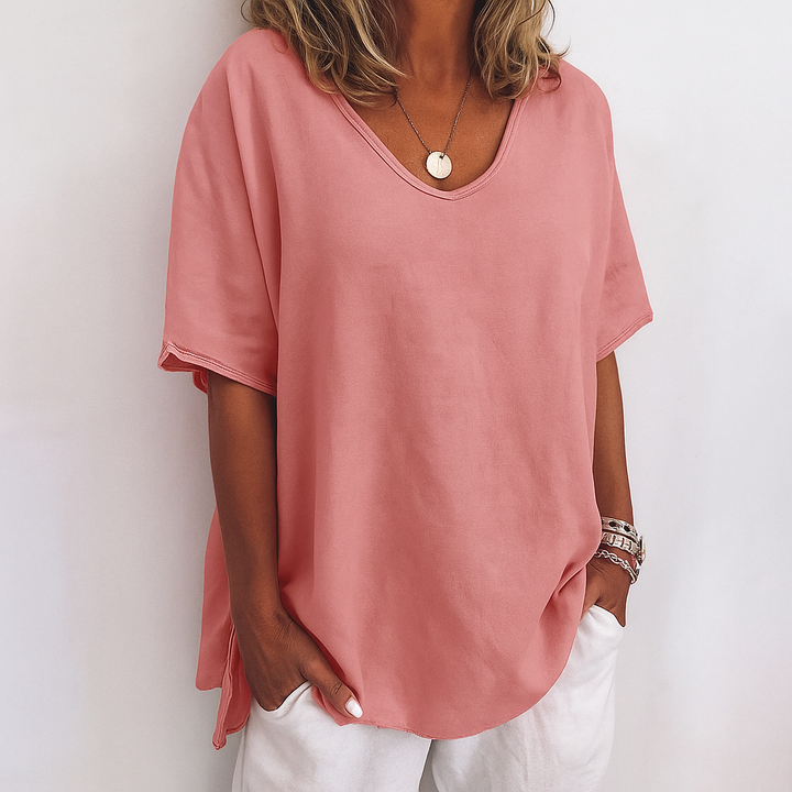 Effortless everyday women's relaxed fit short sleeve top. Casual comfort with a stylish scoop neck design.