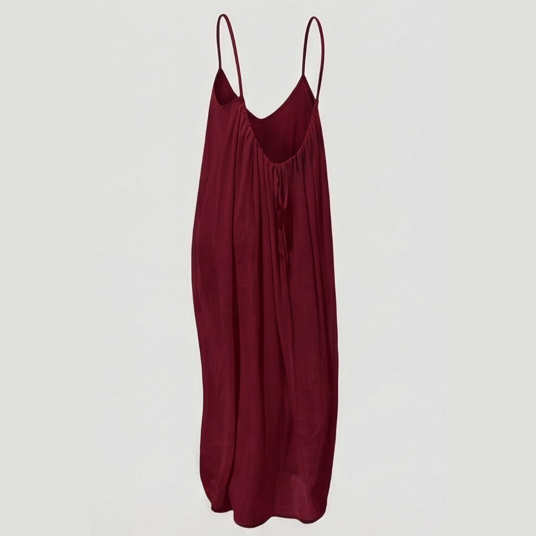 Stylish women's flowy maxi dress with an attractive open back and delicate spaghetti straps.
