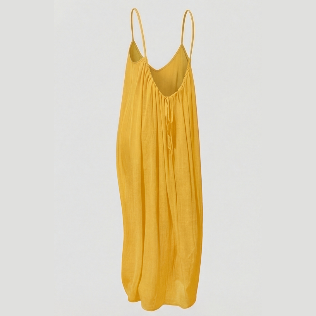 Comfortable women's flowy summer dress with an open back design, ideal for warm weather.