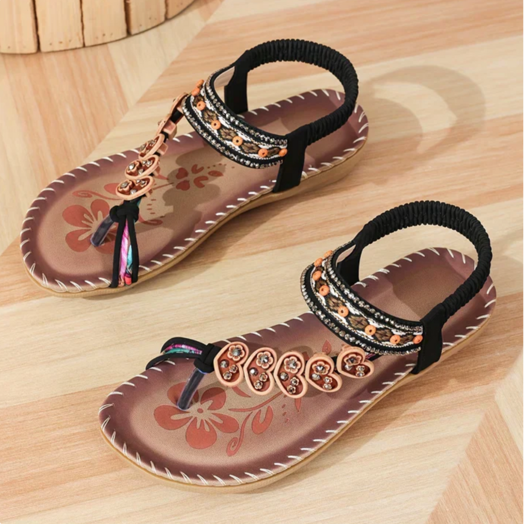 Close-up of the bohemian T-strap design on women's orthopedic sandals, highlighting arch support & style.