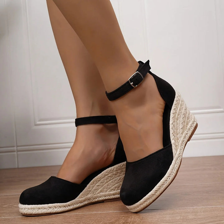 Stylish women's espadrille wedge sandals, ergonomic design for foot support and walking comfort.
