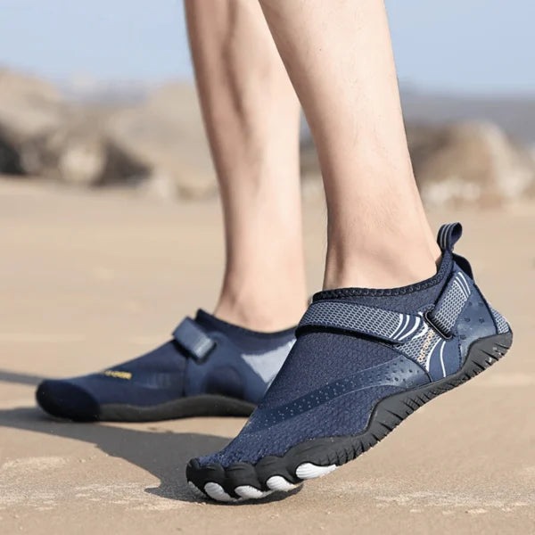 Close-up of men's water shoes featuring breathable mesh & durable material for quick-dry comfort & robust foot support.