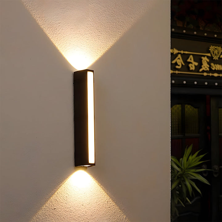 Minimalist black LED outdoor wall light tube, modern & energy-efficient for exterior house lighting.