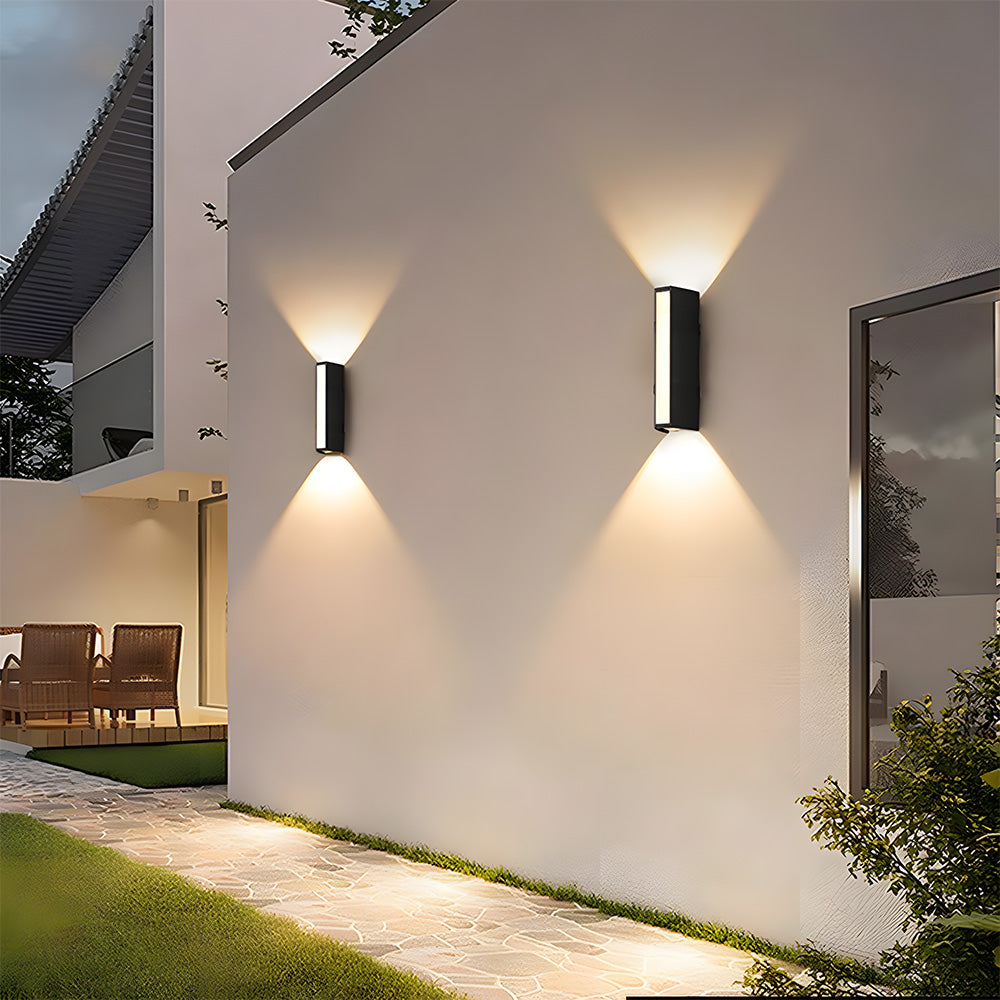 Contemporary black LED tube wall lamp, providing minimalist and bright outdoor architectural lighting.
