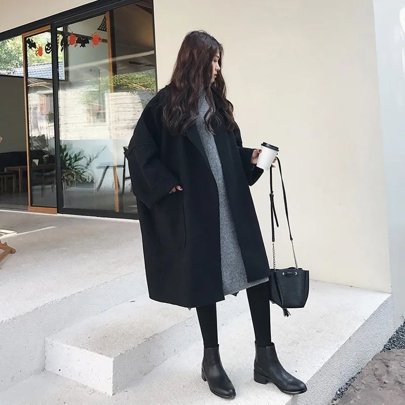Chic women's oversized wool blend double-breasted trench coat, elegant and classic long outerwear.