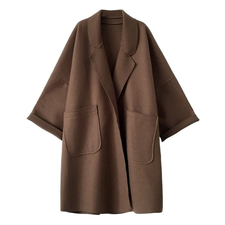 Stylish women's oversized trench coat, a versatile wool blend outerwear layer for elegant fall fashion.
