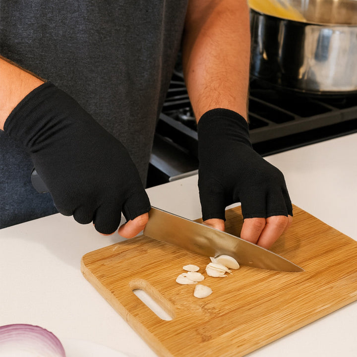 Model wearing therapeutic compression gloves for hands, providing warmth & relief from arthritis and joint pain.