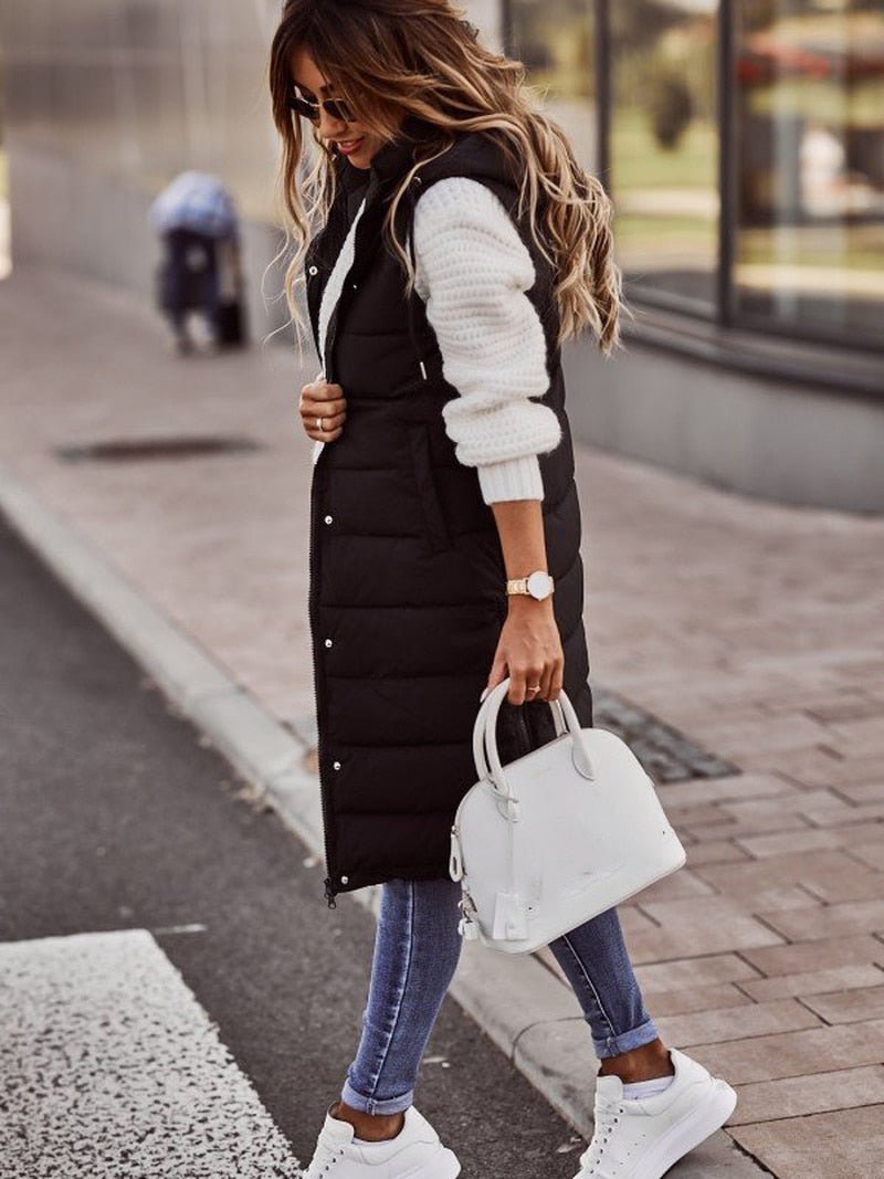 Warm women's knee-length quilted puffer jacket, essential winter coat for extreme cold weather.