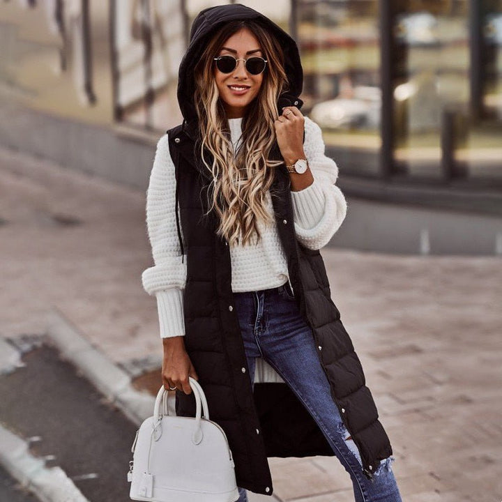 Stylish women's beige knee-length quilted puffer jacket, perfect fashion outerwear for winter.