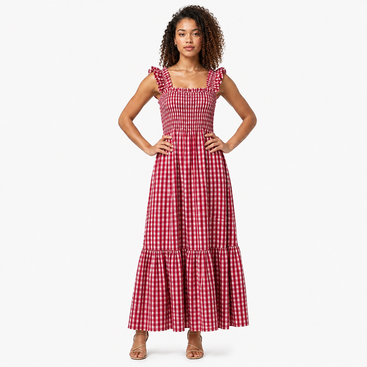 Women's chic gingham maxi dress. Elegant ruffle strap detail and tiered skirt for a breezy summer look.