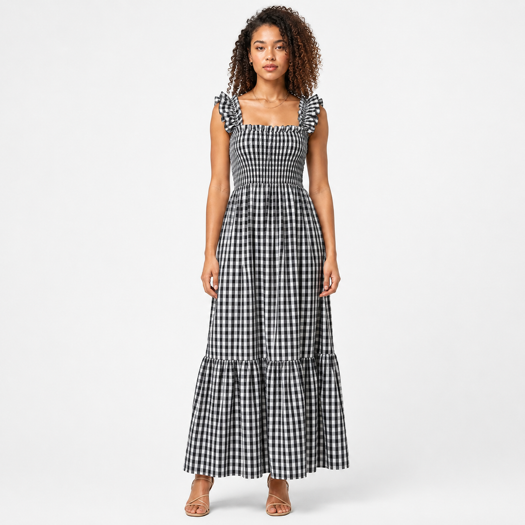 Women's smocked bodice gingham maxi dress, showcasing flowy tiered skirt and delicate ruffle straps.