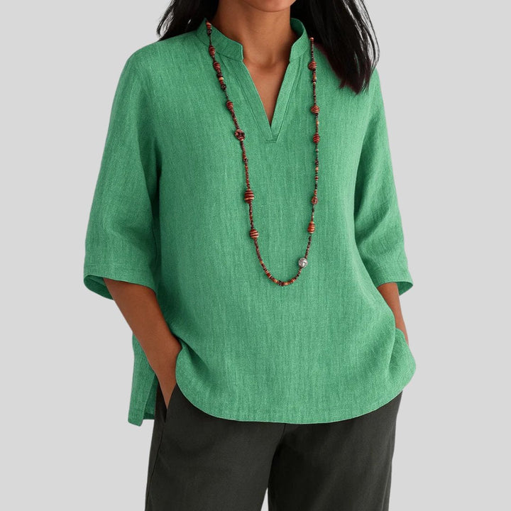 Women's timeless relaxed fit V-neck tunic top with stylish split hem. Perfect casual elegant longline spring summer wear.