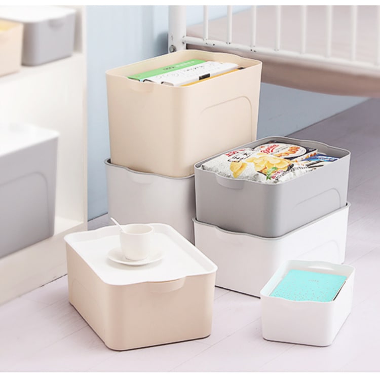 Stackable clear plastic storage bin with lid for home, closet, and garage organization.
