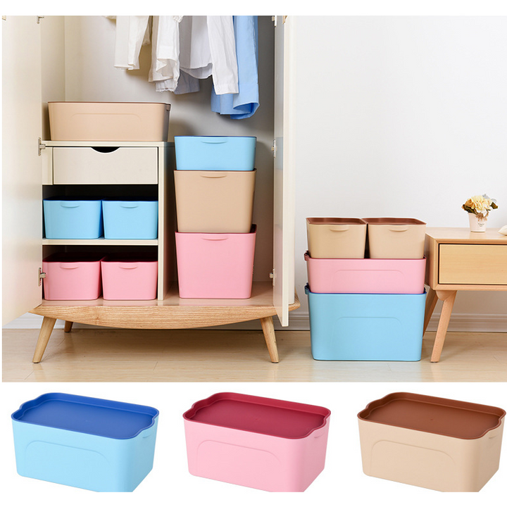 Clear plastic storage container with lid filled with children's toys for easy bedroom organization.