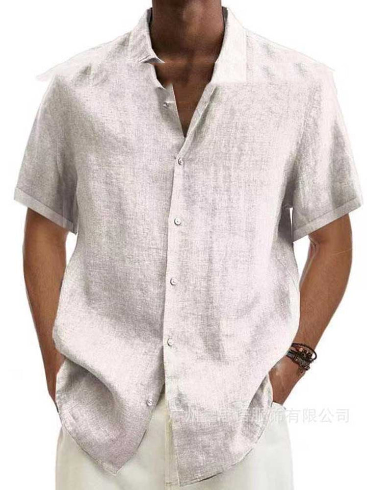 Man wearing a comfortable men's classic button down shirt, suitable for both office and leisure.