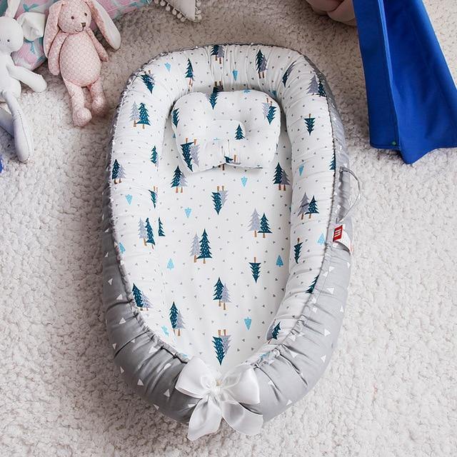 Comfy cotton infant nest lounger, providing a snug and secure spot for baby's safe sleep.