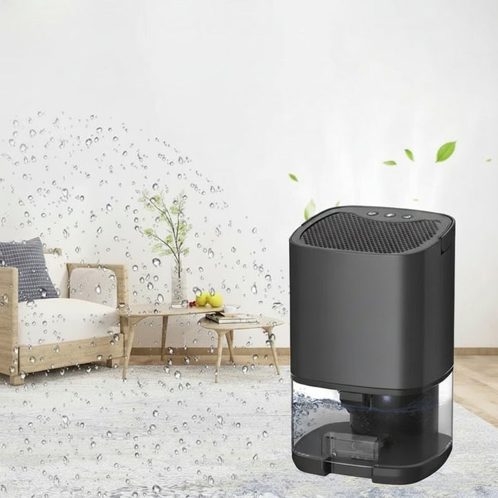 Portable compact dehumidifier, ideal for bedrooms, basements, and small spaces. Effective moisture removal.