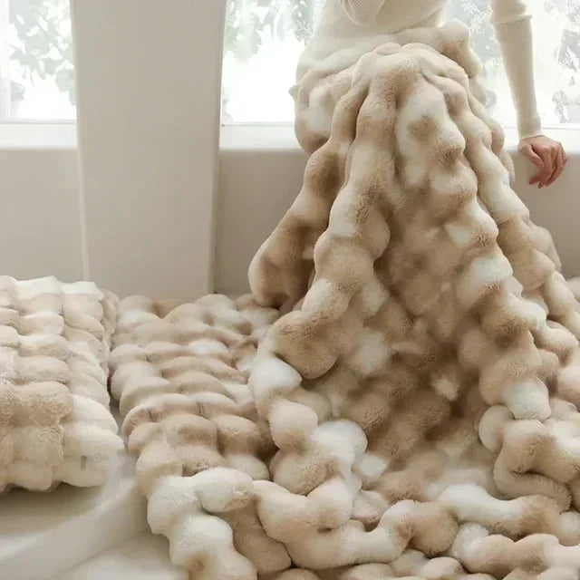 Ultra-soft faux fur VeluLuxe blanket, fluffy beige throw for luxurious comfort & warmth.