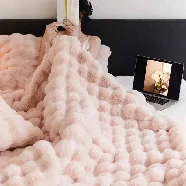 VeluLuxe cream faux fur blanket, a soft & fluffy throw for stylish home decor and cozy comfort.