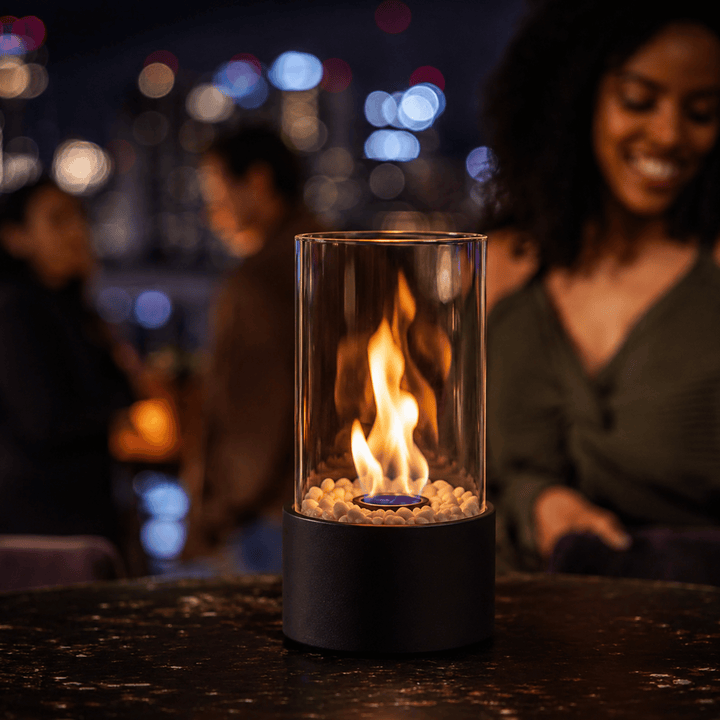 Modern tabletop ethanol fireplace, a sleek home accent for indoor warmth or outdoor patio ambiance.