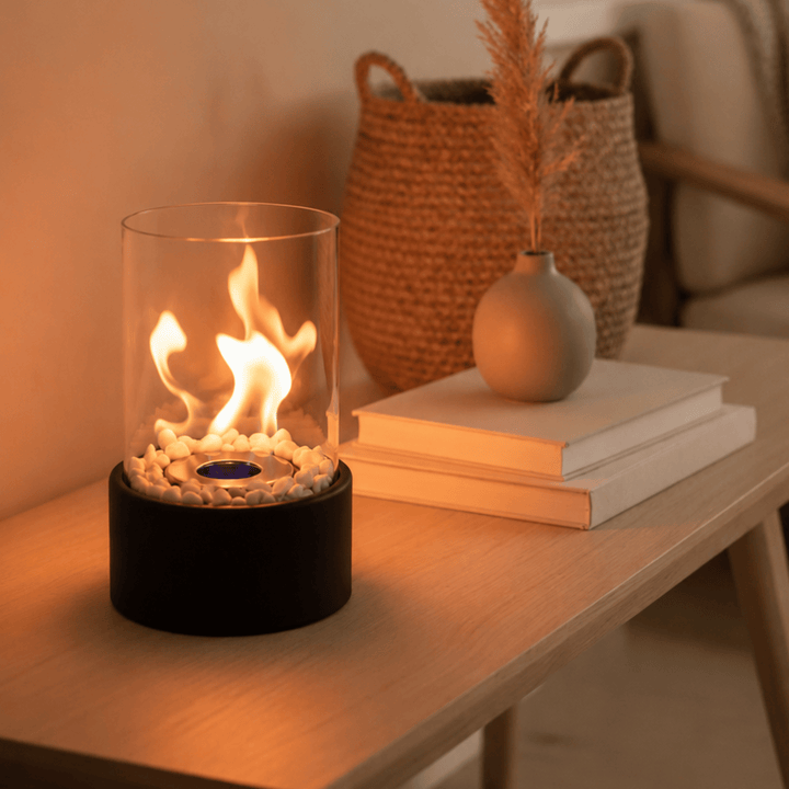 Bioethanol tabletop fireplace creating outdoor ambiance on patios & balconies with a smokeless, portable design.
